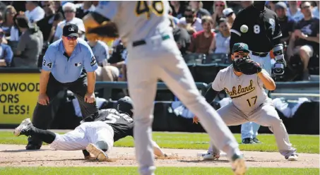  ?? Charles Rex Arbogast / Associated Press ?? In addition to his usual slick defense, Yonder Alonso (17) has found his power stroke, helping give the last-place A’s a sometimes exciting offense. An infusion of rookie bats has livened up the A’s lineup in recent weeks during a largely dull season.