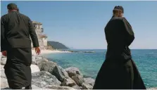  ?? ?? Monks wait for a boat in Ouranoupol­i, Greece, to travel to the Orthodox Monastic Community of Mount Athos, in a file photo.