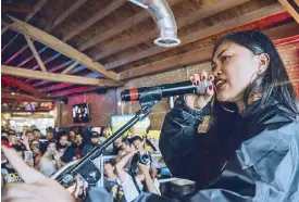  ?? Festival Photos by KAYLA DELSON ?? Billboard-charting artist Ruby Ibarra fires up the crowd at the Kultura Festival.