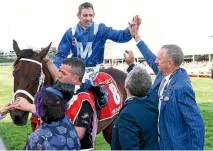  ?? PHOTO: GETTY IMAGES ?? Hugh Bowman celebrates with Winx’s owners after her third Cox Plate triumph.