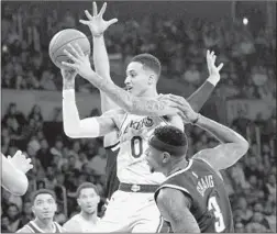  ?? Luis Sinco Los Angeles Times ?? KYLE KUZMA of the Lakers dishes a pass Thursday night amid tight defensive pressure from the Nuggets. He finished with 22 points.