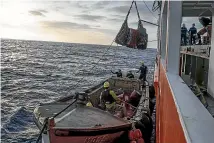  ?? ?? An outpost of Britain, Pitcairn is administer­ed 5000km away in Auckland. Right, both island visitors and supplies are carried in on longboats from the supply ship.