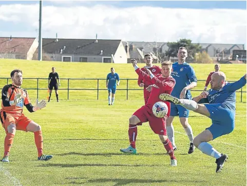  ??  ?? Lochee United (blue) beat Carnoustie 2-0 at Laing Park last week in the Super League.