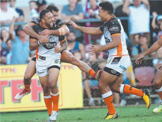  ?? OLD GOLD: Tigers playmaker Benji Marshall celebrates scoring a try during yesterday’s game against Manly at Brookvale oval. ??