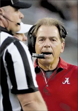  ?? AP/DAVID J. PHILLIP ?? Alabama Coach Nick Saban yells toward an official during the top-ranked Crimson Tide’s 27-19 victory over Texas A&M on Saturday. The Tide, who host Arkansas this week, had won their first two SEC games by a combined score of 125-3.