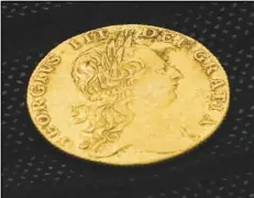  ?? ASSOCIATED PRESS ?? Shown is a King George III gold guinea, discovered in an excavation site, Tuesday, at the Red Bank Battlefiel­d Park in National Park, NJ.