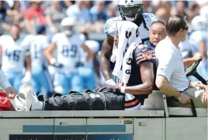  ?? | MARK ZALESKI/ AP ?? Since Cam Meredith was carted off the field during a preseason game ( above), the Bears’ injury issues have worsened.