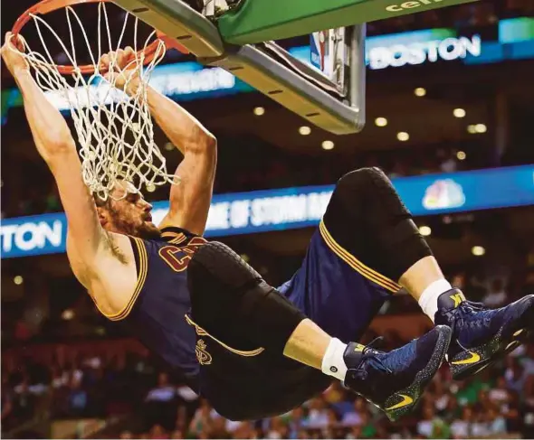  ?? AFP PIC ?? Cavaliers’ Kevin Love dunks the ball against Celtics in their Eastern Conference finals in Boston on Friday.