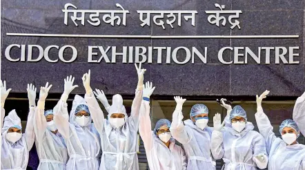  ?? PTI ?? Nurses pose for a picture on the occasion of Internatio­nal Nurses Day, at NMMC Covid-19 care centre, Navi Mumbai, on Wednesday.
—