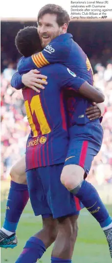  ?? — AFP ?? Barcelona’s Lionel Messi (R) celebrates with Ousmane Dembele after scoring against Athletic Club Bilbao at the Camp Nou stadium.
