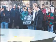  ?? Luther Turmelle/Hearst Connecticu­t Media / ?? Protesters outside Yale University’s Sterling Memorial library listen to speakers during a rally and march Friday.