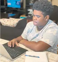  ?? TAVOIE HAMILTON ?? Dixon Grove, a Grade 8 student, is pictured on his first day of online learning in April. A Toronto District School Board committee this month called for more “interactiv­e” learning.