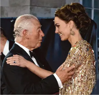  ?? Chris Jackson/Associated Press ?? Britain's King Charles, left, then the Prince of Wales, speaks with Kate, the Duchess of Cambridge as they arrive for the world premiere of the new film from the James Bond franchise 'No Time To Die', in London on Sept. 28, 2021.