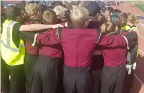  ?? Photo: Courtesy Joshua Hurst ?? Members of the Maple Mountain High School Band celebrate with a group hug.