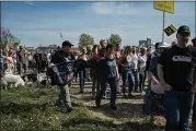  ?? LENA MUCHA — THE NEW YORK TIMES ?? QAnon supporters join protesters marching against coronaviru­s safety measures on Sept. 20in Düsseldorf, Germany.