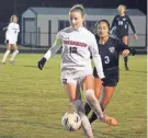  ?? CLAYTON FREEMAN/FLORIDA TIMES-UNION ?? Creekside midfielder Chloe Iliff (12) passes the ball against Bartram Trail.