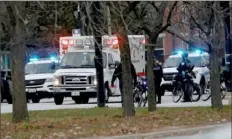  ??  ?? An ambulance believed to be carrying an injured Chicago police officer departs Mercy Hospital on Monday.