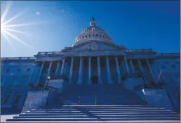  ?? Getty Images/tns ?? The sun shines over the U.S. Capitol Building on an autumn afternoon in November.