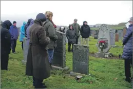  ??  ?? Luing islanders laid a wreath at the memorial stone dedicated to 15 Latvian sailors who died on October 26, exactly 80 years ago.