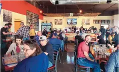  ?? COURTESY OF JAKE GUTIÉRREZ ?? Nearly 200 people came out to Boxing Bear’s Firestone Taproom on Nov. 20 to vote in the final round of the IPA Challenge. In the background, staff pour the beer samples.