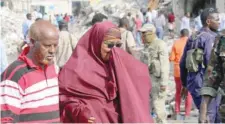  ?? Reuters ?? A Somali woman mourns at the scene of an explosion in KM4 street in the Hodan district of Mogadishu on Sunday. —