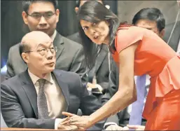  ??  ?? Odd couple: Nikki Haley chats with her Chinese counterpar­t at the UN.