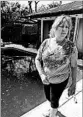  ?? DAVID J. PHILLIP/AP ?? Lynette Borrel surveys her backyard pool of murky water and minnows after returning home Wednesday.