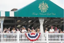  ?? Saul Loeb / AFP via Getty Images 2017 ?? People watch President Trump arrive for the 2017 U. S. Women’s Open Championsh­ip at his course in Bedminster, N. J.