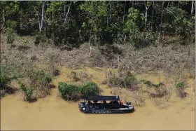  ?? EDMAR BARROS — THE ASSOCIATED PRESS FILE ?? Police navigate the Itaquai River in the Javari Valley Indigenous territory, Atalaia do Norte, Amazonas state, June 10in Brazil.