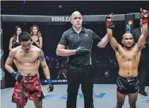  ??  ?? FILIPINO FIGHTER Rene Catalan was declared winner after stopping Chinese Peng Xue Wen by TKO in the second round of their strawweigh­t clash at “ONE: Kings of Courage” in Jakarta on Saturday night.