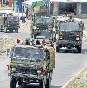  ?? WASEEM ANDRABI/HT PHOTO ?? An army convoy moves along a highway leading to Ladakh on Wednesday.