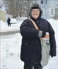  ?? JULIE COLLINS/CAPE BRETON POST ?? Angela Payne, who has been a dedicated Cape Breton Post carrier for 10 years, didn’t let a little snow keep her from getting out early Wednesday morning. Payne has four routes and with the help of her brother Darren delivers 100 papers. In the...