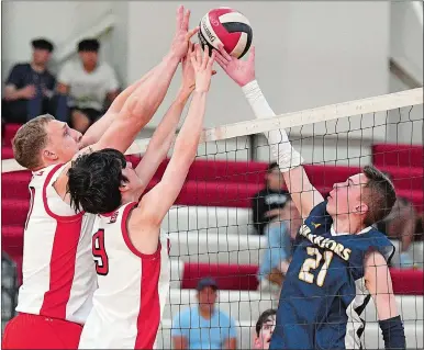  ?? SARAH GORDON/THE DAY ?? NFA’s Gage Hinkley (11) and Gavin Hecker (9) attempt to block a shot from Norwich Tech’s Cameron Maskaly (21) during a boys’ volleyball match on Tuesday at Norwich Free Academy. Please go to theday.com to view a photo gallery.