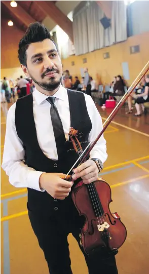  ??  ?? Syrian violinist Sari Alesh, who came to Victoria as a refugee in 2016, will perform at a fundraisin­g event at St. Peter’s Anglican Church on Sunday. Proceeds will go to two organizati­ons assisting those seeking asylum in this city.