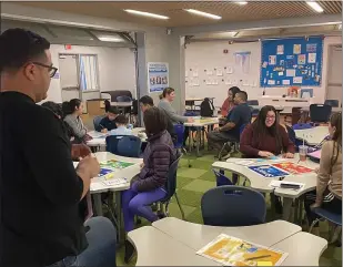  ?? PHOTO COURTESY OF YMCA OF SILICON VALLEY ?? Parents at Robert Randall Elementary School in Milpitas learn Google’s Internet Code of Awesome — Be smart, alert, strong, kind and brave — at a free Feb. 11workshop hosted by YMCA of Silicon Valley. The workshop was one of more than 315 held at YMCAs throughout the country in observance of global Safer Internet Day.