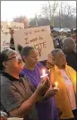  ?? LEON STAFFORD / LSTAFFORD@AJC.COM ?? About 100 people attended a Stockbridg­e candleligh­t prayer vigil Monday to oppose efforts by Eagle’s Landing to form its own city.