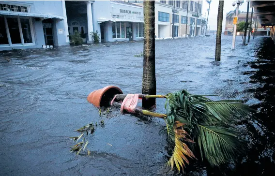  ?? PHOTO: REUTERS ?? Submerged . . . Downtown Fort Myers was flooded after Hurricane Ian made landfall in southweste­rn Florida.