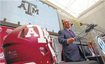  ?? THE ASSOCIATED PRESS ?? First-year Texas A&M football coach Jimbo Fisher speaks at SEC Media Days in Atlanta.