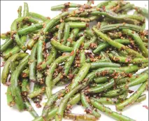  ?? Associated Press photo ?? This photo shows garlic green beans in Coronado, Calif. This dish is from a recipe by Melissa d'Arabian.