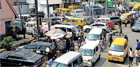  ?? Picture: AFP ?? FUELLING ANGER. Drivers wait in line to buy fuel at a filling station at Obalende in Lagos on Monday. Nigerians continue to express hardship caused by ongoing fuel scarcity across the country, which is gradually grounding economic activities, as drivers spend hours in traffic gridlocks .