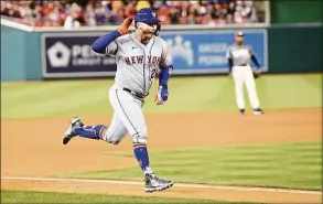  ?? Greg Fiume / Getty Images ?? The Mets’ Pete Alonso rounds the bases after hitting a grand slam in the fifth inning against the Nationals on Saturday.