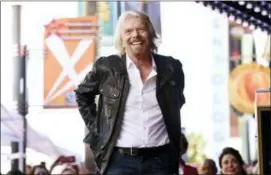  ?? PHOTO BY CHRIS PIZZELLO — INVISION — AP FILE ?? In this file photo, British business magnate Richard Branson appears at a ceremony honoring him with a star on the Hollywood Walk of Fame, in Los Angeles.