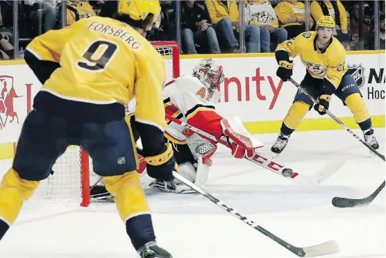  ?? THE ASSOCIATED PRESS ?? Calgary Flames goaltender Mike Smith made 43 saves in a shutout win Tuesday over the Nashville Predators, saying he felt more calm than he did the first two games.