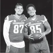  ?? NWA Democrat-Gazette/ANDY SHUPE ?? Razorback tight ends Jack Kraus (left) of Bentonvill­e and Cheyenne O’Grady of Fayettevil­le have developed a bond after playing on opposite sides in a storied high school rivalry.