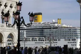  ?? Luca Bruno, Associated Press file ?? A cruise ship passes by St. Mark’s Square filled with tourists, in Venice, Italy, on June 2, 2019.