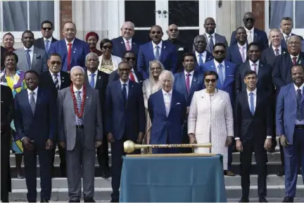  ?? ?? King Charles III (centre) poses with Commonweal­th leaders attending his coronation during a reception at Marlboroug­h House, London