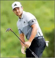  ?? AP/MATT YORK ?? Xander Schauffele tied the Plantation course record with an 11-under 62 to win the Tournament of Champions on Sunday in Kapalua, Hawaii.