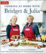  ?? DANIEL J. VAN ACKERE — AMERICA’S TEST KITCHEN VIA ASSOCIATED PRESS ?? This image provided by America’s Test Kitchen in May 2018 shows the cover for the cookbook “Cooking At Home With Bridget And Julia.” It includes a recipe for spaghetti with lemon, basil and scallops.