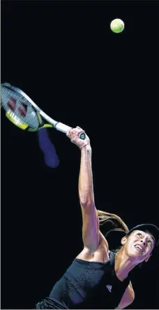  ?? Picture: Clive Brunskill/getty Images ?? SWING AND A MISS: Ana Ivanovic of Serbia serves on her way to victory over Simona Halep of Romania in the BNP Paribas WTA Finals at Singapore yesterday, though she missed out on a place in the semi-finals. Report, above.