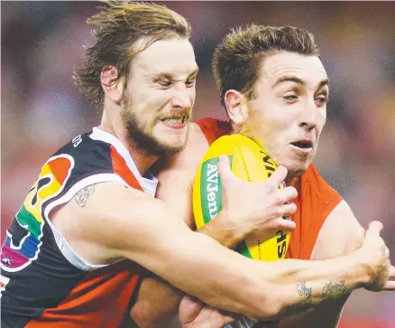  ?? Picture: GETTY ?? RARE SHINING LIGHT: Jimmy Webster of the Saints tackles Swan Daniel Robinson on Saturday night.